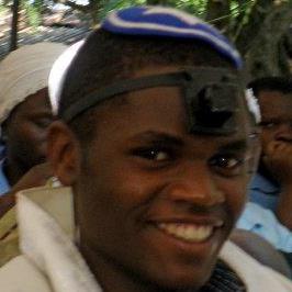 Samson Nderitu with tallit and tefillin (phylacteries)