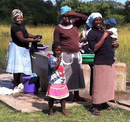 Lemba women gather at the local water hole to do their laundry Photo by Jack Zeller