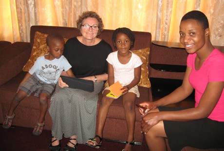 A quiet moment. With Elaine are Trecy, far right, her daughter Nyasha and Modreck's son Aviv (Photo by Modreck Maeresera)